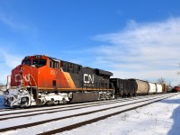 CN 369 is departing Dorval, with CN X371 at right stopped at Dorval, waiting for permission to head west. They are delayed due to an incident involving VIA 61 in Coteau which delayed all VIA Rail and CN freight trains. CN X371 would leave a half hour later.
