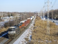 CN 327 is a train that runs through to CSX tracks and that almost always has CSX power. Today was an exception with NS 1025 and BNSF 1114 providing the power on a sunny winter afternoon as the train is westbound on CN's Kingston Sub.