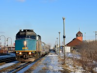VIA 635 departs Dorval Station after boarding passengers on a sunny afternoon. 