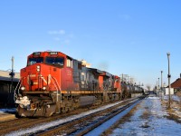 CN 2203 & CN 2295 lead CN 377 past the VIA Dorval Station on a sunny afternoon. At left is a small portion of the parallel AMT Dorval Station.