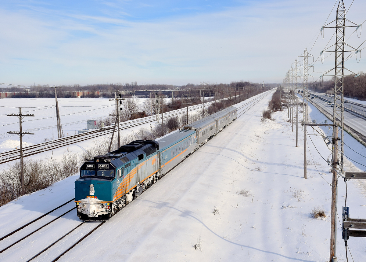 VIA 6405 has a bit of snow on its nose and plow as it leads VIA 35 west through Sainte-Anne-de-Bellevue.