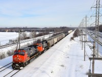 CN 2650 & CN 5779 lead a 98-car CN X371 through Sainte-Anne-de-Bellevue.