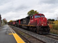 It seemed like a normal Saturday morning, and in the middle of running errands I decided to make a stop by the station, as it would be around the time that CN 331 showed up. Sure enough, a headlight showed and I wasn't exactly sure what to expect, as foreign power was extremely common back at this time. But what I got was something even cooler. As 422 was just approaching the St Paul Street bridge, a long wave of fresh red, black and white paint was visible. A long string of new engines from Erie, making their first trip on the Grimsby Subdvision. The new engines were 2892, 28xx, 2983, 2886 and 2895. The fresh paint looked great on them, a refreshing look compared to the dirty GEVOS that are usually down here.