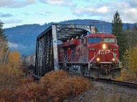 This truss style bridge is common on the Shuswap sub. This shot shows CP 8767 crossing the Eagle River in Sicamous at the head of a westbound load of grain.