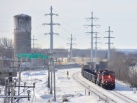 Dash9-44CWL BCOL 4641 is in CN colors but still has its double set of ditchlights (with one of them not working or off) as it leads CN 310, seen curving onto the island of Montreal. Trailing is CN 2224.