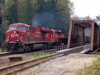 This empty coal train is crossing the Eagle River at Malakwa behind CP nos.8788&5003. The SD30ECO units were used on CP coal trains from mid 2014 for about a year until mechanical problems caused their demise. At the present time ES44ACs and AC4400s are used consistently as prime power units.
