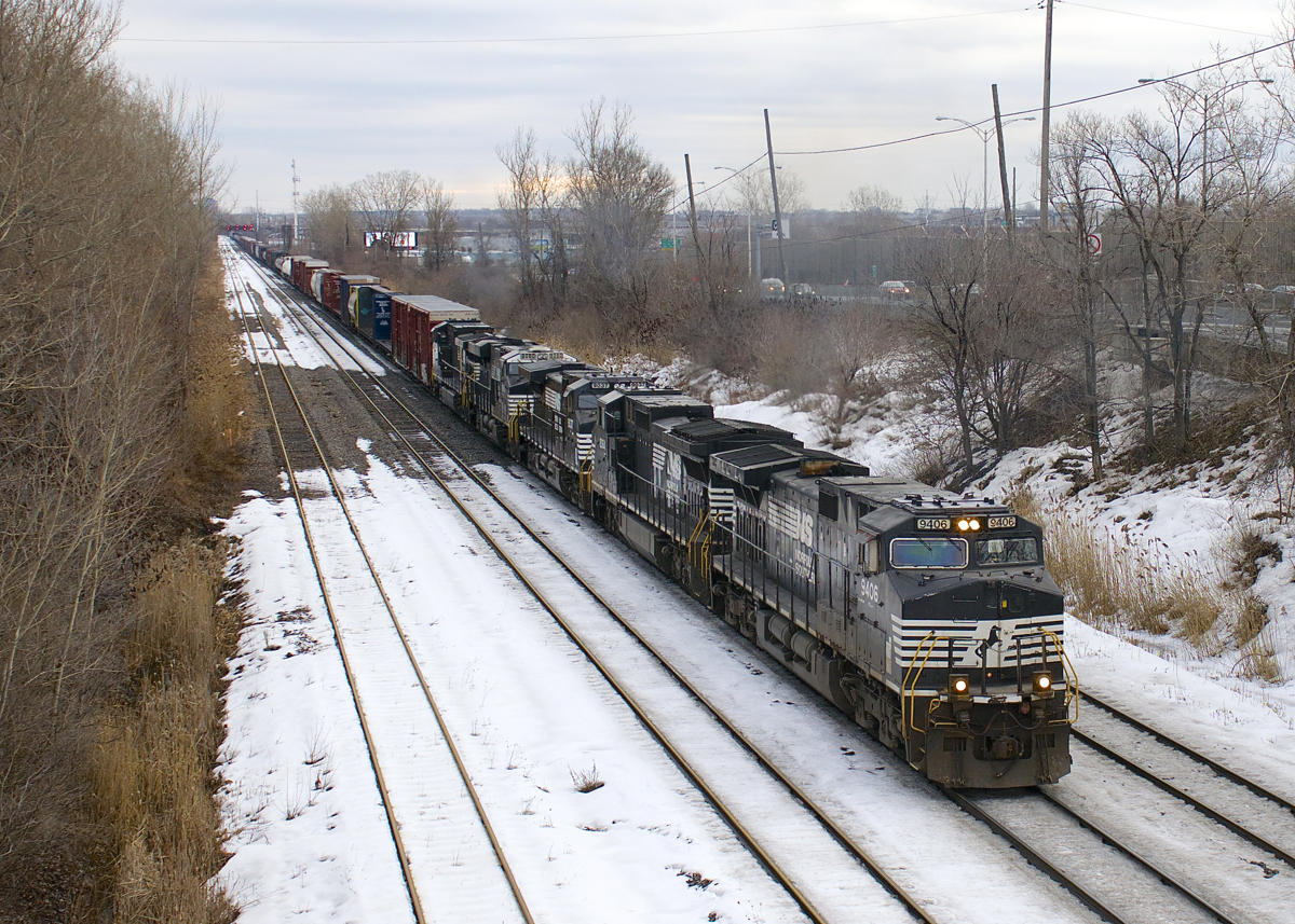 Five NS GE's (NS 9406, NS 8364, NS 9037, NS 8080 & NS 9139) it lead a much longer than usual (94 cars) CN 529 towards Taschereau Yard. If this seems like more power and cars than usual it's because this is two days worth of CN 529.