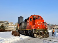  A Port of Montreal employee is flagging the last crossing as CN 149 passes with ex-Oakway SD60 CN 5404 leading a truly frigid morning.