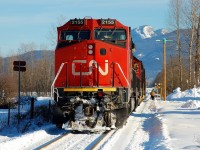 This day reminded me very much of Alberta, cold and sunny. CN nos.2155&5421 have picked up a couple of loaded pole cars and are preparing to leave westwards for Lavington. In the background can be seen Camelback Mountain.