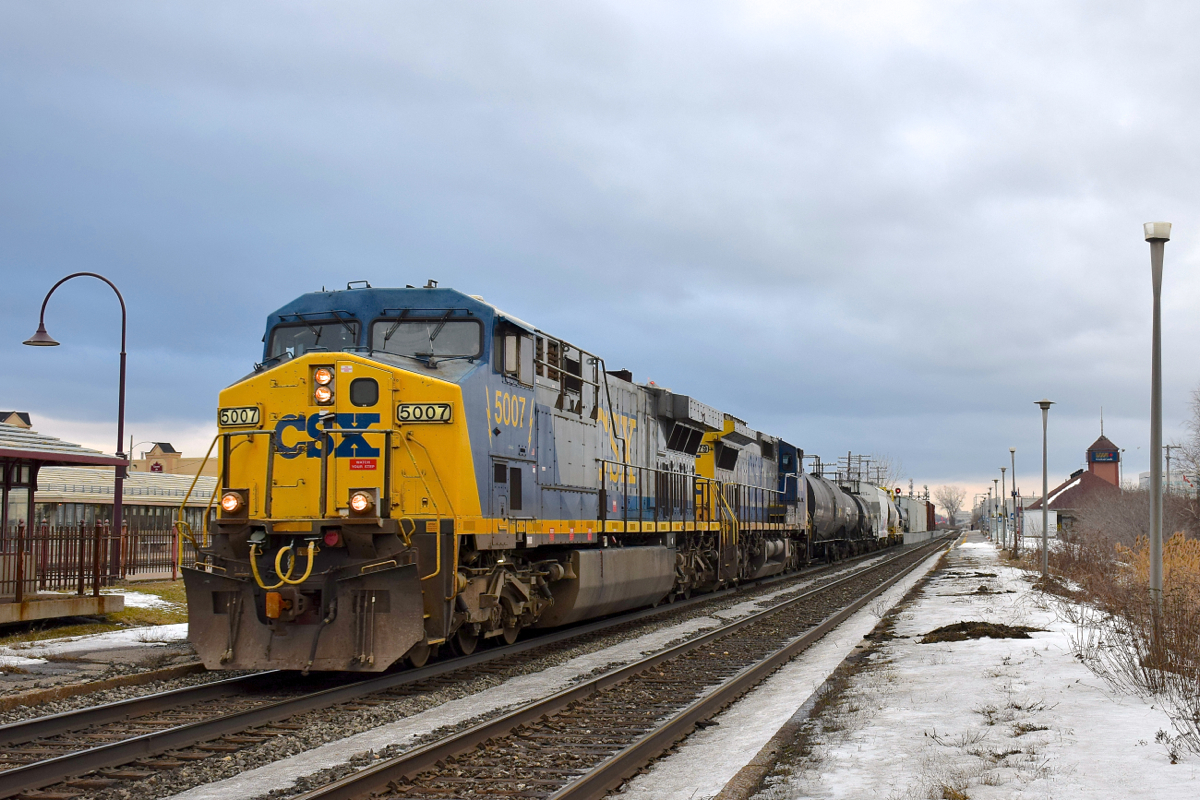 CN 327 has two GE's in the YN2 paint scheme (AC6000CW CSXT 5007 & Dash8-40CW CSXT 7879) as it heads west through Dorval with a short train of only 47 cars
