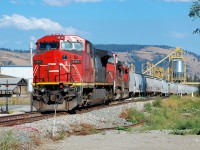 A new wood pellet plant became operational in Lavington during the fall of 2015. This view shows IC 2465 along with CN nos.2598&2542 picking up some cars and preparing for an early evening departure.