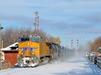 Clean UP 5506 leads ethanol train CP 650 through Lasalle Station on a sunny winter morning the day after Montreal got a bit more snow.