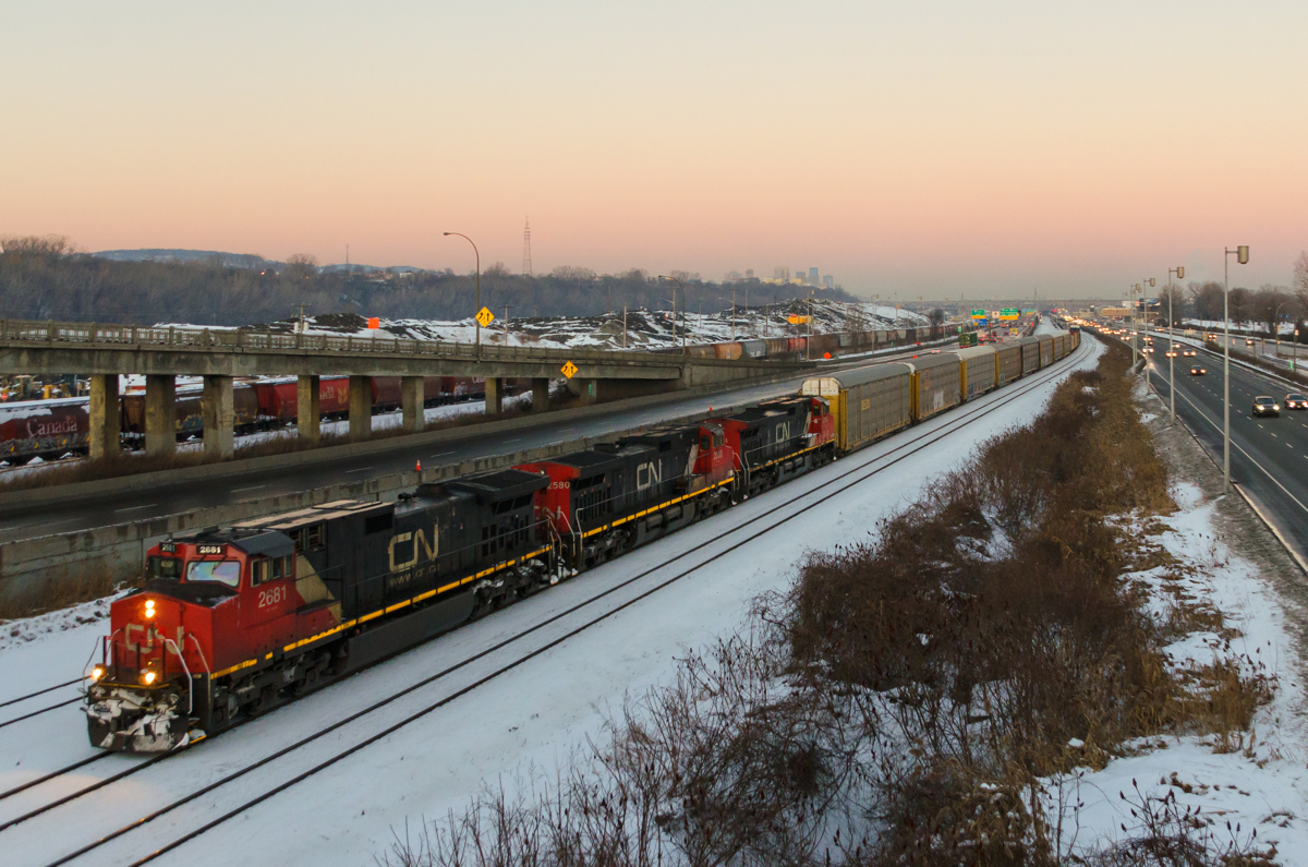 A trio of Dash9's leads CN 401 westwards on the Montreal Sub a few minutes after sunset.