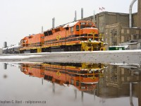 For generations there has been two constants at the Kitchener Station - the Krug furniture factory and a railway. The motive power continues to change, witness this reflection of SLA 3806 in nice, flared GP40X body with a matching paint calf 806. US and Canadian flags flapping in the background in a factory under significant pressure to turn into Condos, especially once the LRT Is up and running a block away. And snake, no, I did not use a case of water to create this pond :)