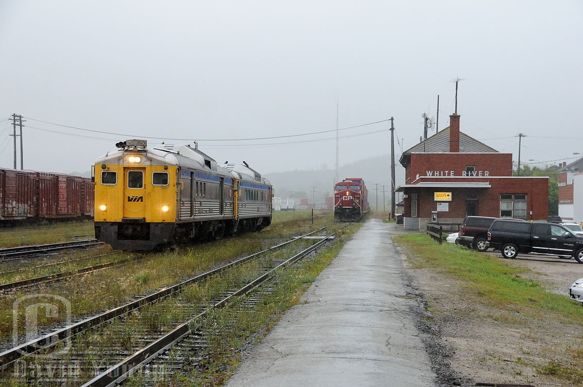 A miserable and wet morning in White River, Ontario finds Ontario's Budd's departing for Sudbury. RDC4 6250 and RDC-2 6215 are assigned the honours for the trip to Sudbury, while in the background train 112-18 sits staged awaiting a crew to come available to take the train east. During this time CP crews based out of Chapleau operated the passenger between White River and Sudbury. A couple years later VIA crews would take over the run to operate the train from the CP crews.