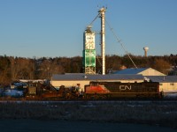 After being cancelled, rescheduled, rescheduled once again, sided for a northbound, and 2 crews being paid, the CN spreader finally approaches Zephyr siding in last sunlight on a "CP like" day.