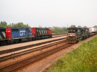 Good old days, already. This scene is only from 1988 but it shows late afternoon activity at the far end of the long Fort Erie yard near 'CN Duff'(since pulled up). Arriving from Mac Yard Toronto is CN 2315, GT 6422 and CN 9309; about to pass westbound NS 8629 and 8575.