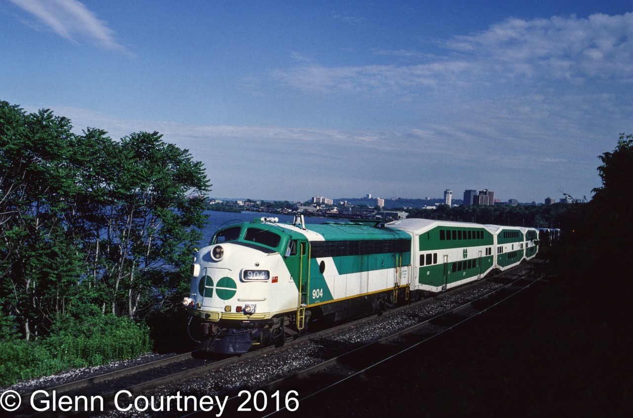There was a time when GO Transit had quite a variety of locomotives leading its trains. Like many commuter agencies it expanded its network in fits and starts and its motive power followed suit. GO 904 was one of GO's APCU fleet (Auxiliary Power Control Unit), F units that no longer powered the train but provided power to the cars and a cab when the train was in push mode. 

I likely would not attempt a shot from this location today. This is train #982 deadheading back to Willowbrock for the night after an afternoon rush hour trip to the old CN station in Hamilton, just getting out of town ahead of the shadows.