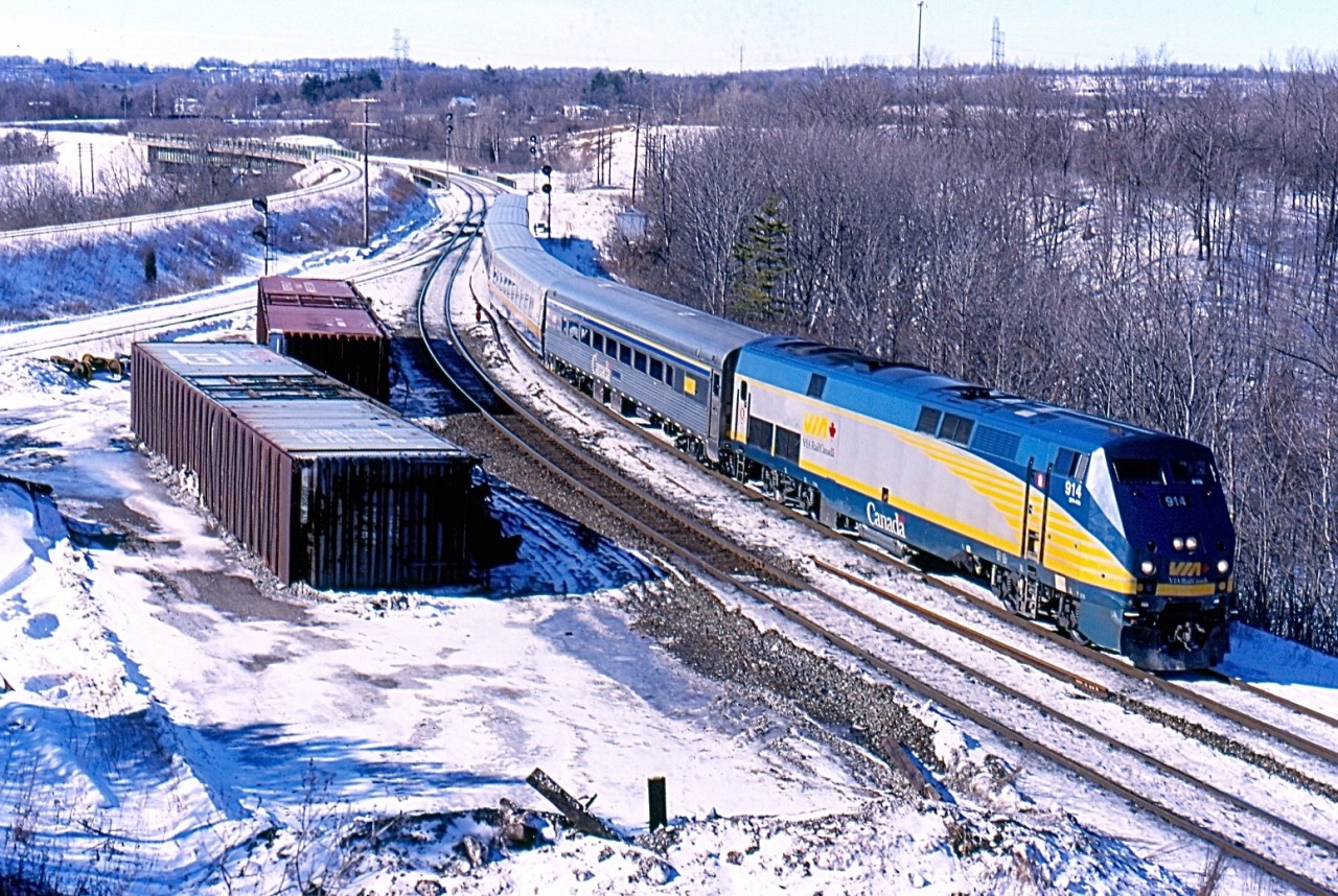 VIA train 72 passes a couple of auto parts cars laying on their sides after the derailment of CN 397 earlier in the week. Snap tack has been installed on the north track until crews can replace the damaged rails in the area.