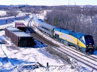 VIA train 72 passes a couple of auto parts cars laying on their sides after the derailment of CN 397 earlier in the week. Snap tack has been installed on the north track until crews can replace the damaged rails in the area.