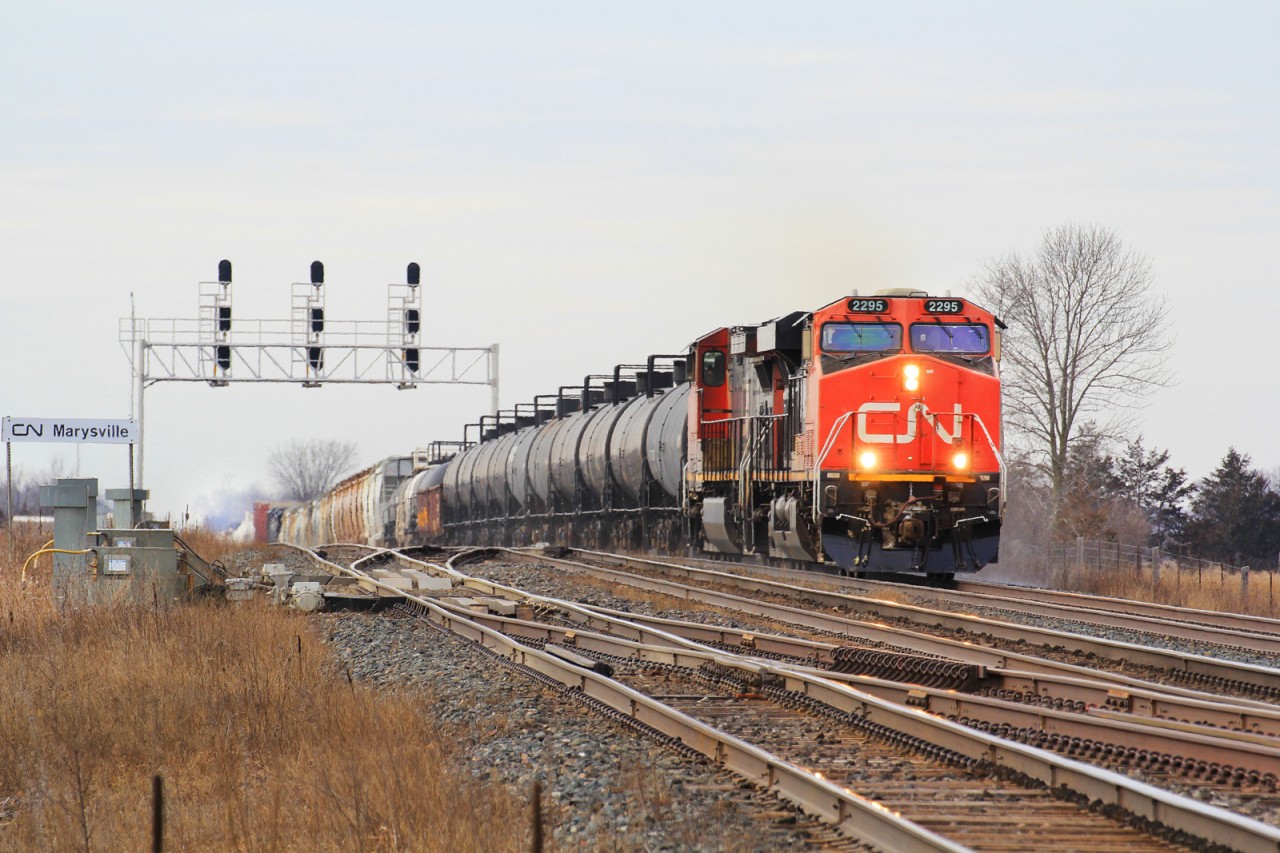 CN M376 works its way up and down the grades east of Belleville making good use of the mid DPU to keep them at good pace.