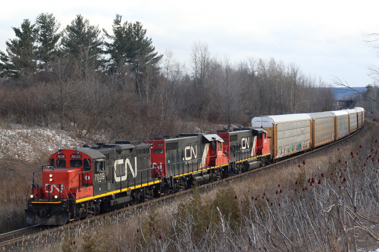These days catching a GP9 leading a train is something you don't ignore. They have already vanished on CP and their numbers have been greatly reduced on CN over the past decade as well. Since local train 547 was relocated a number of years ago from Malport to Aldershot, catching GP9s in the lead passing through Scotch Block was a rare occurrence. This train was most likely an extra out of Aldershot heading to Toronto, with a trio of four axle Geeps up front, and the sound of them struggling up the grade was defining.