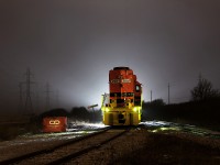 I thought of Mr. Host's requests for more snow shots, and this is the best I could come up with. Over the holidays, my sleeping habits tend to fall really out of wack. I guess I just like night time more. Nonetheless, this was one of those days I was thinking at 2am, I'm going to Nanticoke. And that's what I did, even though a snow storm was approaching. I started by getting pummeled by Lake Erie wind taking photos across the frozen lake, and I ended up here somewhat surprised to see RLHH 2081 sitting just south of the Nanticoke name sign. By this time, the snow had really picked up. Although there was not much snow on the ground, there was plenty falling. Photo opportunities like this are hard to come by, and the transformer station to the north was really lighting up the night, so instead of darting home, I faced the wrath of fierce wind and some obviously concerned oil truck drivers. In this day and age, being right next to the Esso oil refinery (at night), I did not stay long. What I presume was SOR 597 had also recently arrived at Garnet, indicating crews may have had difficulties with the weather. I would guess RLHH 2081 was tied down after working the Esso Refinery earlier in the night. The waste bin next to it oddly seems to fit well in the photo. It was almost 6am by the time I finished up with my photos, and headed right home. 