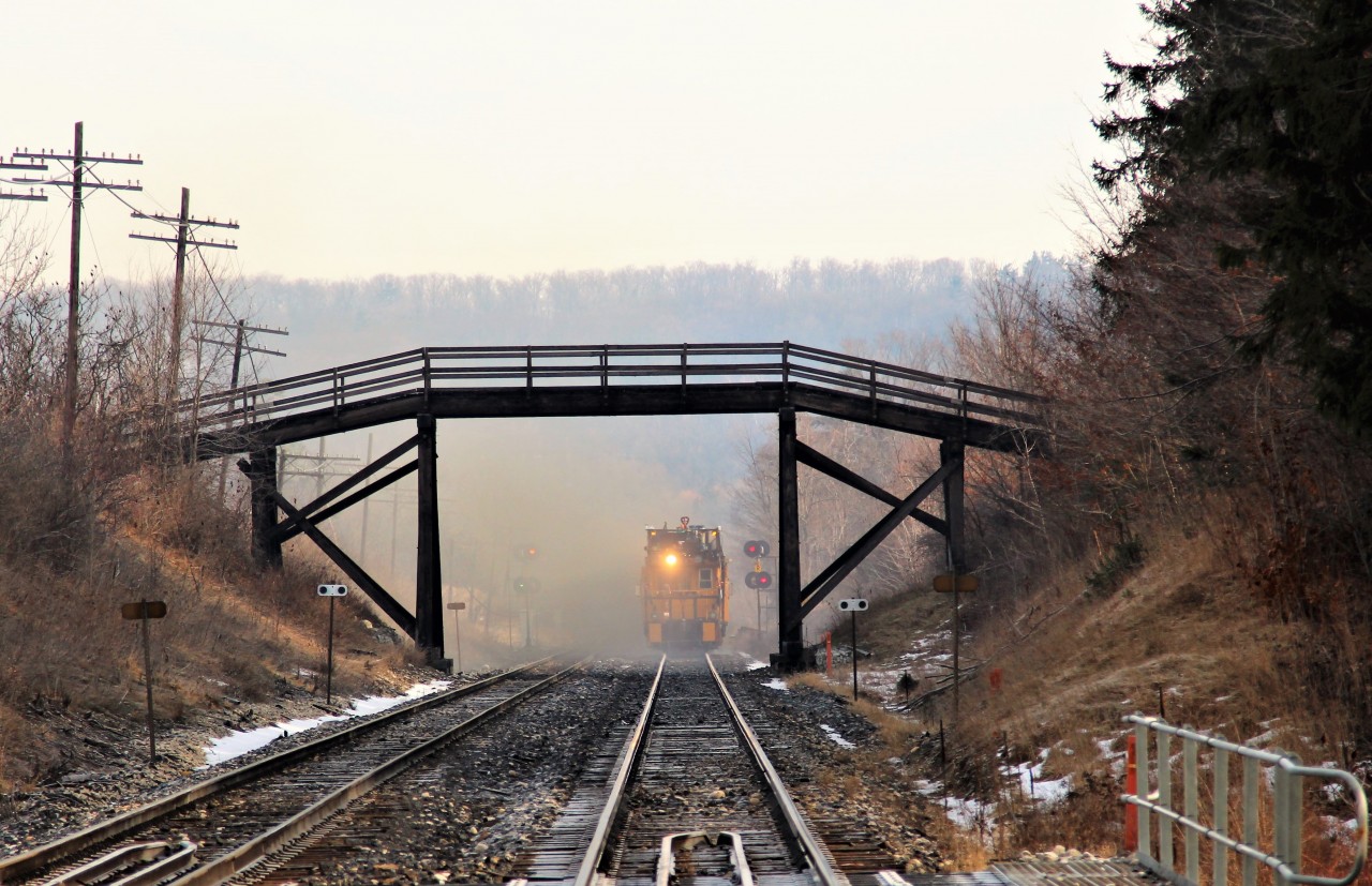 RG319 departs in a cloud of grinding residue after passing under the wooden walk bridge at MM37.