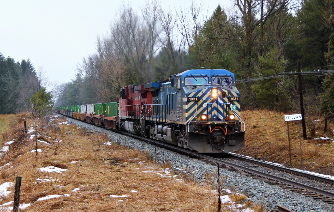 Todays CP240 is led by CEFX 1031 with CP 9819 as it passes the Killean name sign at MM 54 on the Galt Sub.