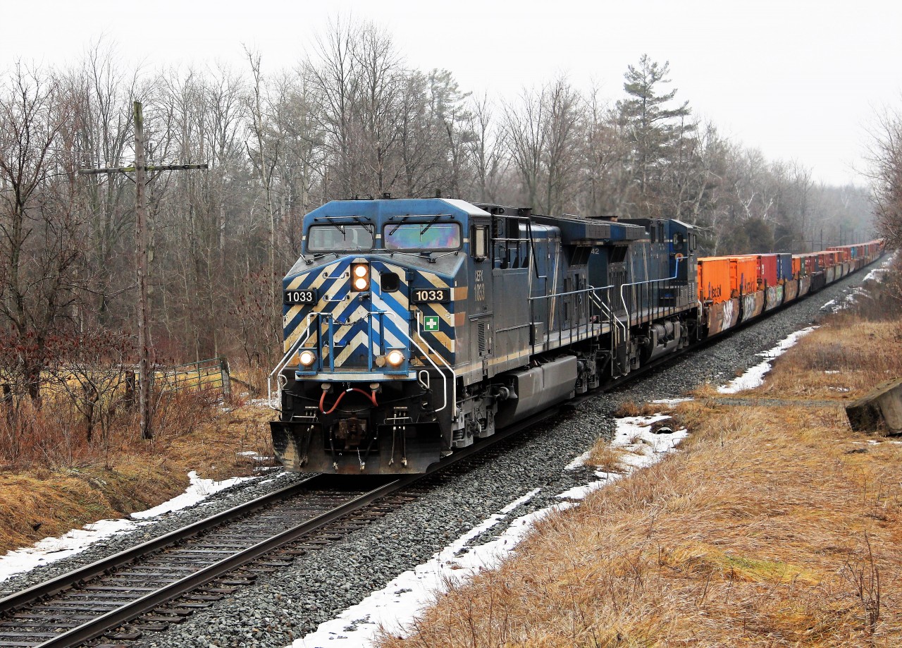 On what was a very eventful morning with CP 235 getting stuck on the Milton hill, CP 141 having break issues at Guelph Junction and this guy, CP 143 losing communication with the tail end after leaving Guelph Junction.
CEFX 1033 with its "Bluebird" partner CEFX 1042 coast up the grade past MM43.2 on their way for a meet to pass with CP 141 at Puslinch siding. The crew from CP 141 will reset their communication devise at the rear and off they would go. This is also a new train for this section of the Galt sub after its rerouting schedule. Finally some extra trains for all us train deprived Galt sub rail fans.