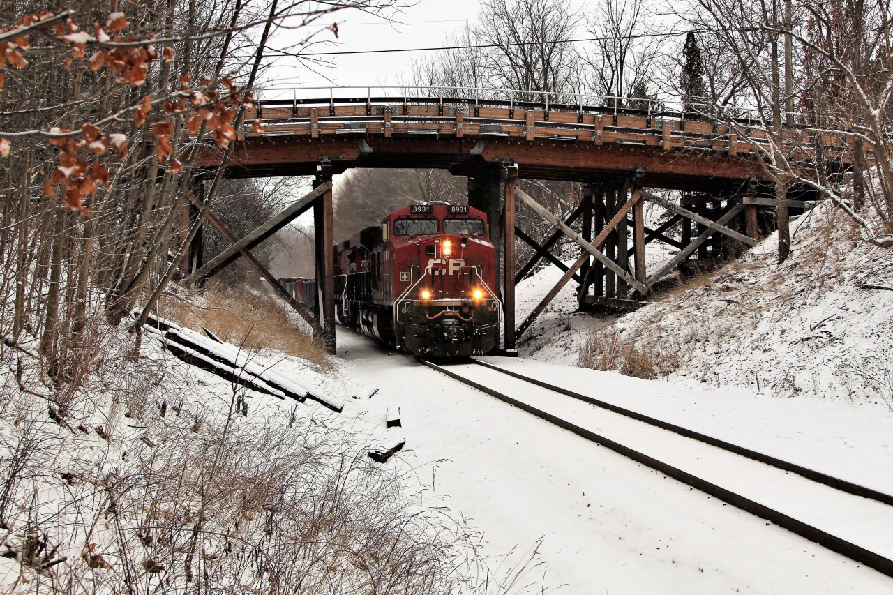 CP 8931 leads CP 8553 under the Snake Road wooden bridge with an empty load of ballast gondolas on its way to Guelph Junction