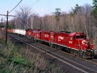 Trains stalling on the grade up the Niagara Escarpment through Campbellville was certainly not uncommon not all that long ago. Train 153 was a hot intermodal train and often was assigned a single unit for its trip to Chicago. Many single unit trains over the years sucumbed to the grade much as 153 did this day. Luckily the "Ham turn" was in the area and it's pair of veteran "Geeps" came to the rescue assisting the SD90 and its train up the hill. Hard to believe that today the GP9s are all gone and the SD90s may never come out of storage again.