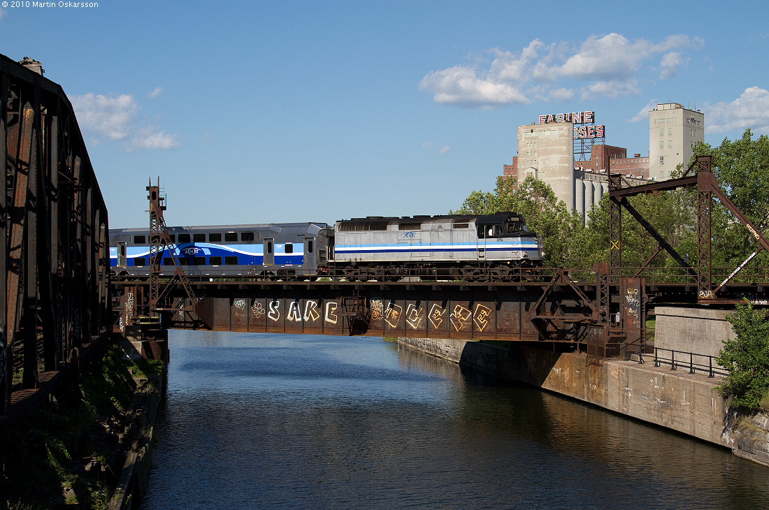 F40 319 leads a commuter train bound for Mont-Saint-Hilaire across the Lachine Canal in Montreal.