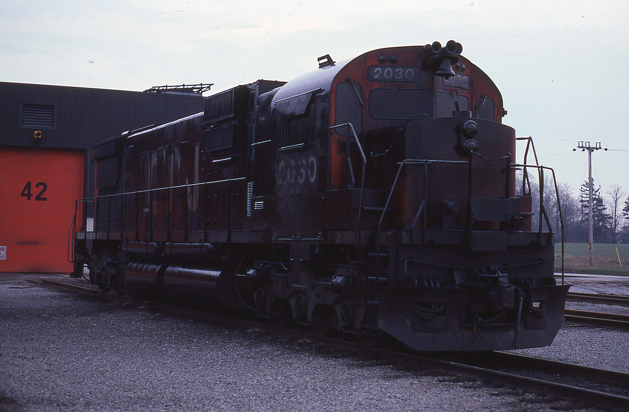 While wandering out back at MacMillan Yard some years ago when I actually could, I happened across this old MLW CN 2030 in a state of despondency after suffering some sort of oil bath. Probably a unit ahead let loose out on the road.  I am hoping someone out there in the know could give a run down on just what they think lead to this. Thanks!!