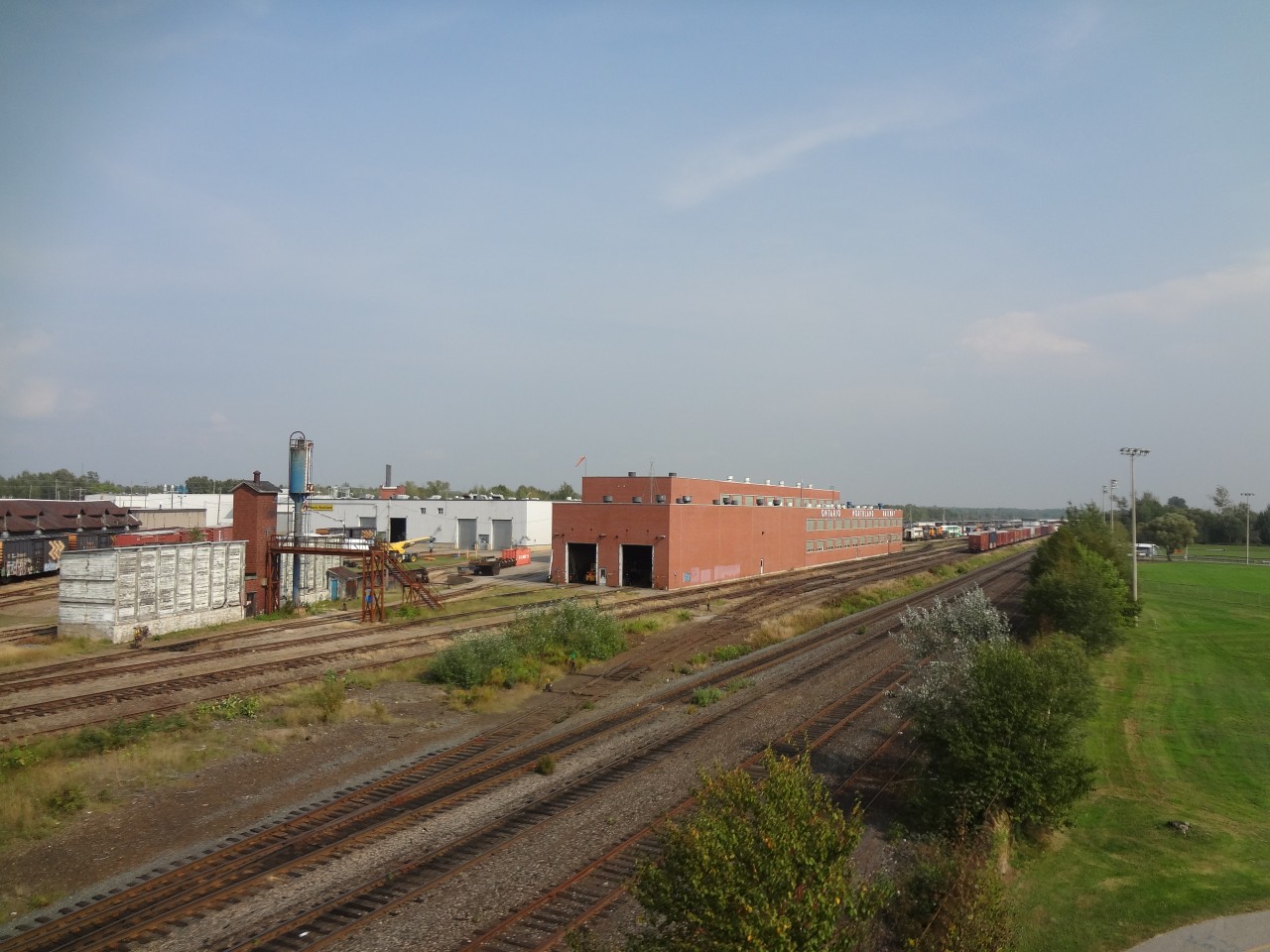 40 years after Mr. Mooney's recently submitted photo of ONR's North Bay, ON shop complex, I snapped this shot from a similar location which captures some of the changes to the buildings and grounds over the intervening years.  The main shop buildings have been extended, the turntable relocated, and some track realignments to mention a few.