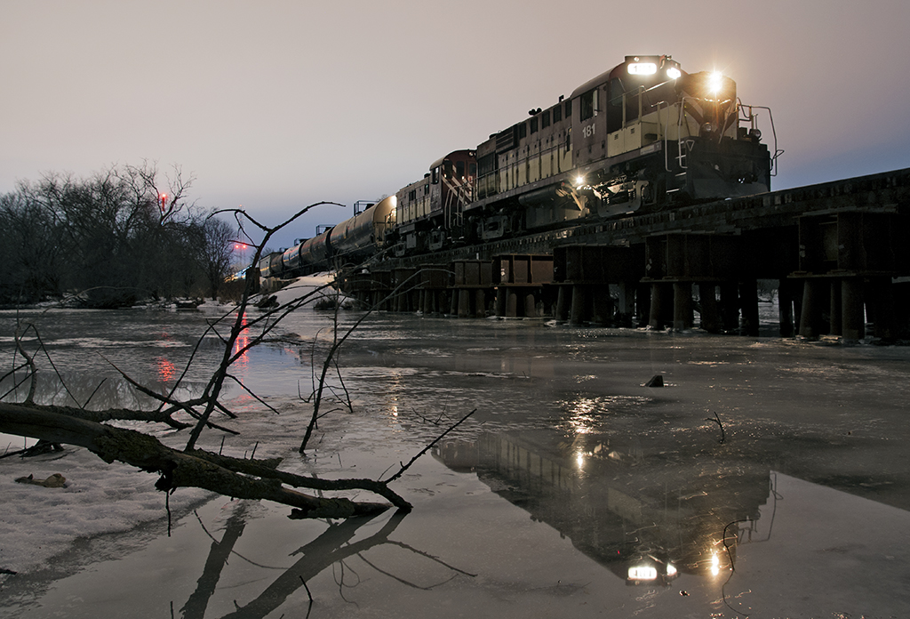 Some nights just come together or so they say, we are done for the night up in Guelph and ready for the trip back to the junction with 16 cars, 13 for the ol' CPR and 3 lube oil stores to be flipped over to the Goderich side. I told my hogger before we left town to stop on the bridge so I could get a few night shots of our power. I wasn't satisfied with where the train sat, but telling the hogger over the radio to take it ahead half a car did the trick.