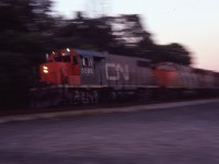 I have long forgotten, but no doubt this was one of those times when the "gang of us" spent the whole day yakking and kabbitzin' at the junction; talking trains and taking pictures as well. I am guessing I probably stated I was not going home until I saw "one more train" for whatever reason. But the sun went down first. Along comes that train, and well, I am there.....so not to waste an opportunity I probably set the camera at about 15h of a sec and tried to pan this thing as it went off the Oakville onto the Dundas. Interesting, anyway. I like it. Numbers not recorded.