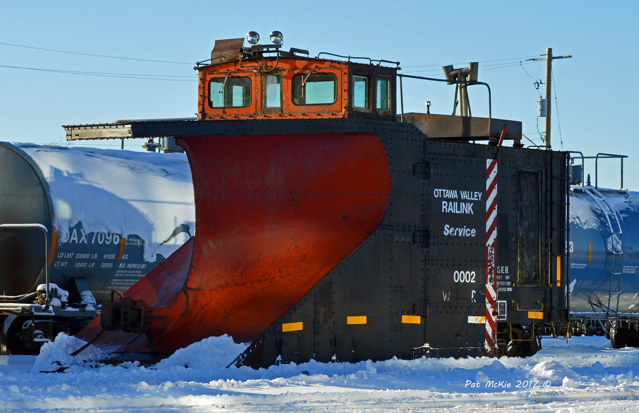 Ottawa Valley Railway Snow plow RLK 0002 sits in the Yard January 6 2016 after being serviced by the OVR shop crew. Both the Plow and spreader were serviced; as Snow in the yard and on the main line is building up.