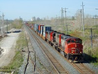 Dave Young would remember this day - he was a young man at this point and I took him on an outing to the Ingersoll area on a beautiful day. The trip was to shoot NS 327/8, of course, but this train turned out to be a highlight that I only recognised years later. A pair of GP40-2W's leading on CN's Flagship Chicago-Toronto intermodal train? Seriously? Is this the 1980's?? Only the ratty paint gives away their age. Clearly this was an exception in the  mid 2000's and now... forget about it.

