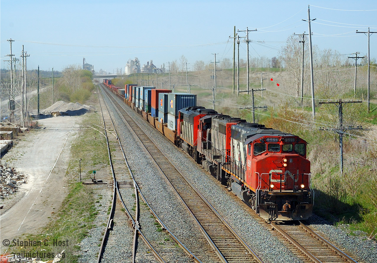 Dave Young would remember this day - he was a young man at this point and I took him on an outing to the Ingersoll area on a beautiful day. The trip was to shoot NS 327/8, of course, but this train turned out to be a highlight that I only recognised years later. A pair of GP40-2W's leading on CN's Flagship Chicago-Toronto intermodal train? Seriously? Is this the 1980's?? Only the ratty paint gives away their age. Clearly this was an exception in the  mid 2000's and now... forget about it.