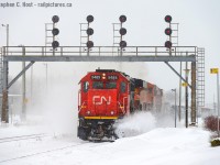 Winter's been disappointing here in  Southern Ontario - so I have to pull photos from past winters to show some action. Here's an eastbound at Sarnia passing under the westbound signal bridge protecting the tunnel. Show your winter shots folks! Let's remind mother nature it's snow, not rain that we want :)

