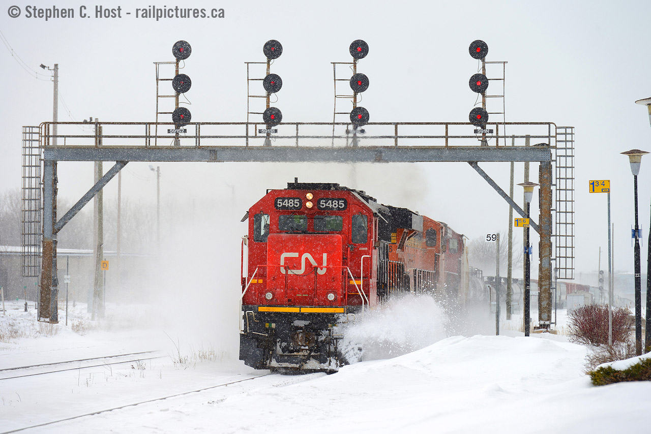 Winter's been disappointing here in  Southern Ontario - so I have to pull photos from past winters to show some action. Here's an eastbound at Sarnia passing under the westbound signal bridge protecting the tunnel. Show your winter shots folks! Let's remind mother nature it's snow, not rain that we want :)