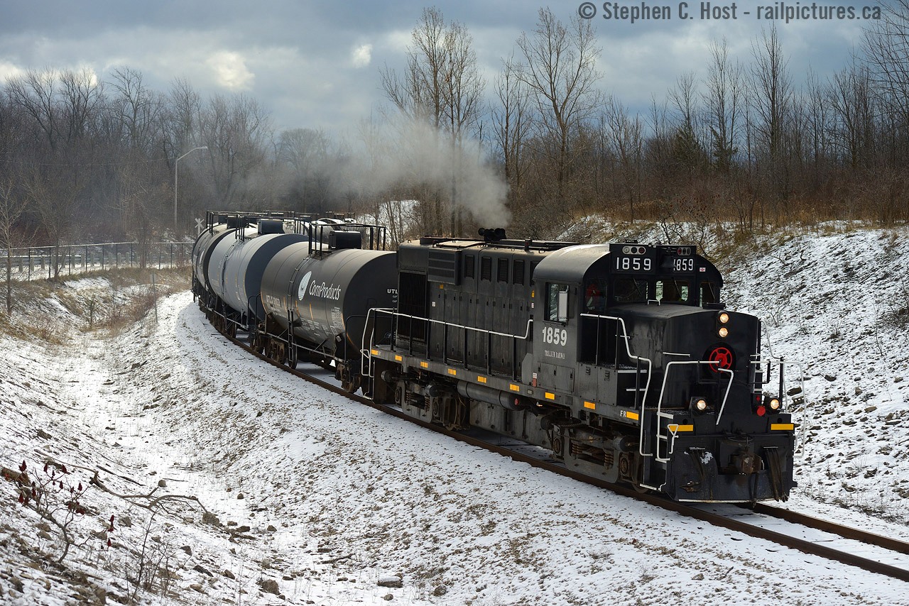 In response to a future photo to be posted by Mike Lockwood which shows the Port Colborne Harbour Railway (Trillium) in their early years climbing the grade out of Port Colborne - I present you this photo which I took, unknowingly, at the same spot - but great minds think alike even when it's 15 years apart!. While Trillium is waiting delivery of GMTX 223, I thought it was high time to see the Alco's in action while it's still a guarantee- this time getting lucky as I'd never shot 1859 before, not even on STER. In this photo the crew had just lifted 7 cars out of the yard by Riverland Agriculture (Robin Hood Flour) to deliver to Ingredion just up the line. With a bit of a grade and curve, 1859 is getting a good workout - a great spot for a bit of action on a mostly flat railway (except the Thorold grade, which will wait for another day!).