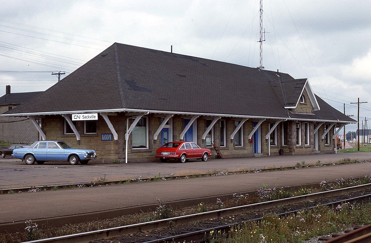 The VIA station at Sackville, NB is a nice basic structure. Too bad it is, of October 2012, closed. The train still stops here, but on-train crews handle baggage after VIA axed the staff here and at nearby Amherst due to funding cuts. It is the same all across the country. The government is bound and determined to kill what there is left in passenger traffic by making it as inconvenient as possible and then plead that "nobody rides the damn thing."  At least that is how I see it.
This station opened in 1907, the first building a small wooden building destroyed by fire. The railroad first came to town when the Intercolonial opened here in 1887. A further extension to the Northumberland Strait at Cape Tormentine and a PEI ferry made this location even more important as a junction.
That was then. Not now.