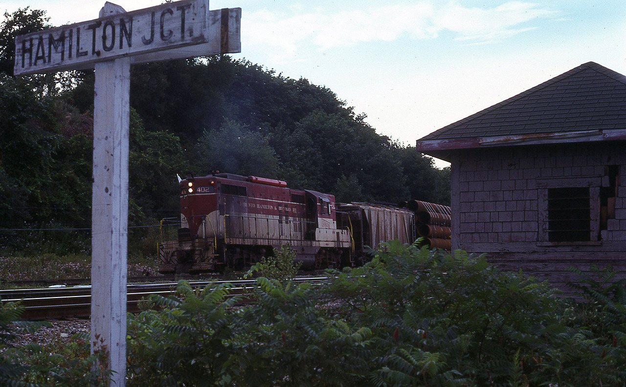 Something I didn't see very often, rarely, actually, was TH&B coming down the CP Waterdown Hill. I was doing the usual late day wander thru the area when I heard a train horn. Coming from the direction of Hamilton West. So I scurried off to this point, hoping to get a shot with the CN "JCT" sign in it. (CP and CN are almost side by side here)  And this was as best as I could do before this short train came into view. It is a bit dark on account it is past 1900 and the sun is behind the hill. But the image is certainly different.