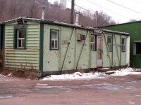 This image should be of interest to many of you on the group; at least those around Southern Ontario. Kinnear Yard was a popular place to check out action on the old TH&B (when this photo was taken)and later on when it became a place to check out diesels on the CP. The old Yard Office has had many faces over the years, and this is how I remembered it best. A drafty old green shack. Former rail car of some sort by the look of it. I get to wondering where the namesign went...............