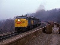 Long cut of MoW gondolas makes a sort of 'different' perch for a shot of eastbound VIA 6761 on a rather gloomy damp day at Dundas. The B unit is 6865.