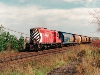 The Guelph Turn powered by a single GP9u pulls 5 grain hoppers through Milton on it's way to Guelph Junction.