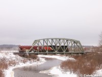 CN 5752 (SD75I), hauls the lone BNSF hopper en route to the final destination of Rockingham, NS before heading west on 121. The HBD down the line recorded them going 42 MPH.