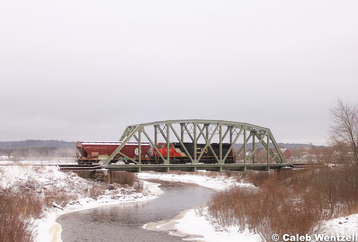 CN 5752 (SD75I), hauls the lone BNSF hopper en route to the final destination of Rockingham, NS before heading west on 121. The HBD down the line recorded them going 42 MPH.